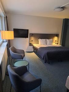 Postel nebo postele na pokoji v ubytování HOTEL N Hostel Malmö City