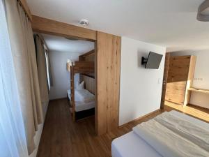 Postelja oz. postelje v sobi nastanitve Berggasthof Hochzeigerhaus