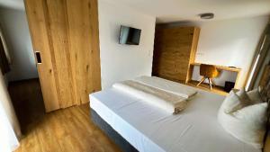 Postelja oz. postelje v sobi nastanitve Berggasthof Hochzeigerhaus