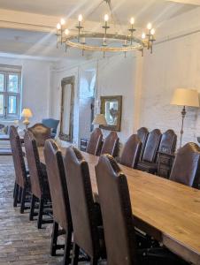 a conference room with a wooden table and chairs at Five Star Luxury - Oxnead Hall in Burgh next Aylsham +59 photos