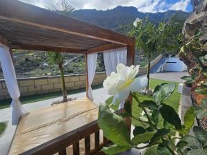 a bed on the balcony of a house at Villa Los Zarzales in Güimar