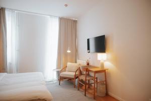 Televiisor ja/või meelelahutuskeskus majutusasutuses The Lab Hotel