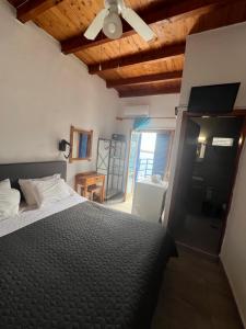 Postel nebo postele na pokoji v ubytování Scirocco Rooms