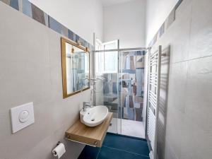 a white bathroom with a sink and a shower at Dallatorre B&B in Lizzano +50 photos