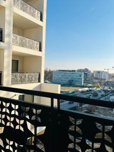 a balcony with a view of a parking lot at Central Grand Apartment in Timişoara