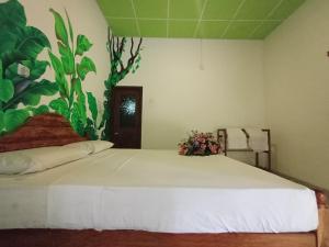 Letto o letti in una camera di Keerthi Homestay