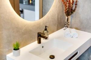 a bathroom with a sink and a mirror at Fly Room - S6 - MPolo in Medulin