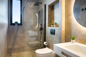 a bathroom with a shower and a toilet and a sink at Fly Room - S6 - MPolo in Medulin