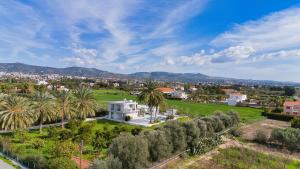 an aerial view of a city with palm trees at Luxury Oasis Villa in Peyia