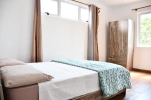 Postel nebo postele na pokoji v ubytování Martello Apartments