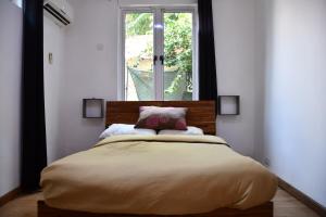 Postel nebo postele na pokoji v ubytování Martello Apartments