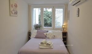 Postel nebo postele na pokoji v ubytování Villa Apollo B&B
