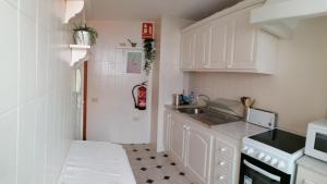 Kuchyňa alebo kuchynka v ubytovaní Maritima Beach apartamento
