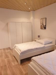 a bedroom with two beds in a room at Monteurwohnung bei Nina EGR in Zeitz