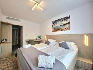 Postel nebo postele na pokoji v ubytování Hotel Crystal