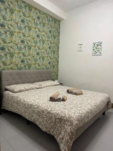 a bedroom with a bed with shoes on it at Ca’ MILLA in Venice