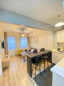a kitchen and living room with a table and chairs at Istanbul Taksim Istiklal Street CasaVilla Hotel in Istanbul