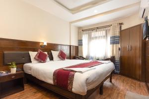 Voodi või voodid majutusasutuse Hotel Buddha toas