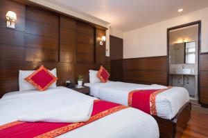 Voodi või voodid majutusasutuse Hotel Buddha toas