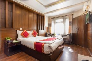 Voodi või voodid majutusasutuse Hotel Buddha toas