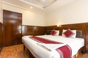 Voodi või voodid majutusasutuse Hotel Buddha toas