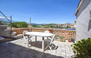 a white table and chairs sitting on a balcony at Cas'Andrea in Castilenti