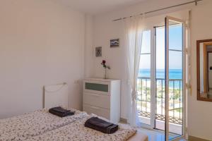 A bed or beds in a room at Casa Bella Vista