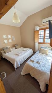 Postel nebo postele na pokoji v ubytování Hostal El Convent de Moncada