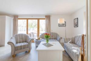 Posezení v ubytování Ferienhaus Dierhagen am Deich