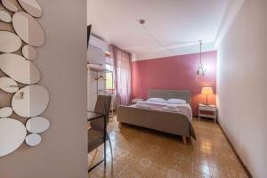 Posteľ alebo postele v izbe v ubytovaní Casapiu Rooms
