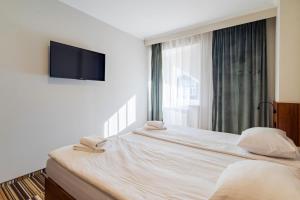 Gulta vai gultas numurā naktsmītnē Hit Hotel