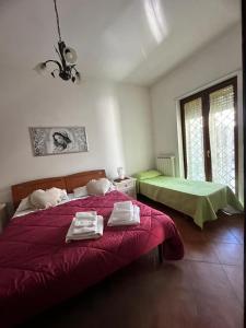 Ένα ή περισσότερα κρεβάτια σε δωμάτιο στο Oasi San Cesario