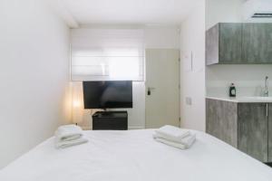 En eller flere senge i et værelse på נופשים על הים