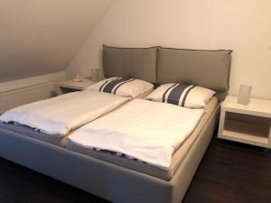 Postel nebo postele na pokoji v ubytování Urlaub in Wieck + 14 fotografií