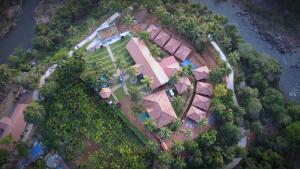 an aerial view of a house with trees at Poliyam Thuruth Eco Tourism Village in Kāsaragod