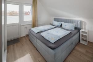 Postel nebo postele na pokoji v ubytování Haus Coordes Wohnung 04