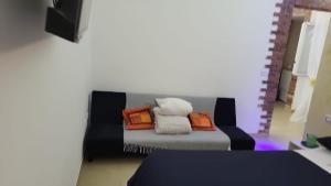 a couch with pillows on it in a room at Apulia lux in Taranto
