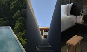 ein Schlafzimmer mit Bett und ein Swimmingpool in der Unterkunft Le Bonheur Khaokho in Campson