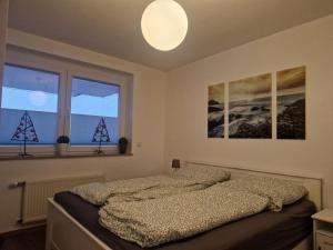 Ένα ή περισσότερα κρεβάτια σε δωμάτιο στο Wohnung 65