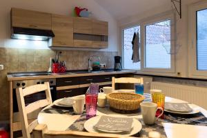 a kitchen with a table with chairs and a tableablish at Ferienwohnung Rode in Müden +9 photos