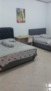 Postel nebo postele na pokoji v ubytování Grand ICON Resort - ALAS PURWO
