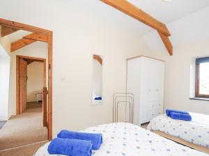 Voodi või voodid majutusasutuse The Dairy Barn toas