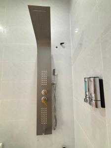 a shower in a bathroom with a shower at Villa Healing Home Hồ Bơi Nước Nóng in Trai Mat