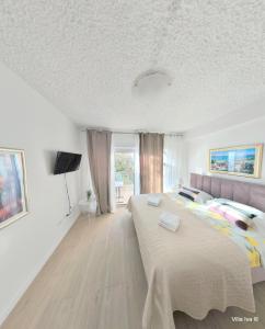 Postel nebo postele na pokoji v ubytování Apartments Iva