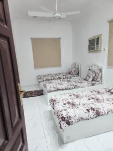 Postel nebo postele na pokoji v ubytování Welcome Seven 5km far from Masjid Nabawi