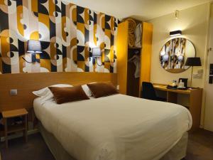 Voodi või voodid majutusasutuse Best Western Hotel Acadie Paris Nord Villepinte toas