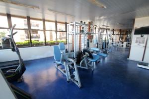 a gym with several treadmills and machines in it at Apartment Ocean View II in Rio de Janeiro