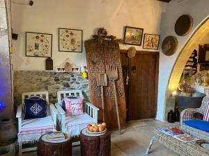 a room with two chairs and a table in a room at Stratos ArtDeco House in Kalavasos