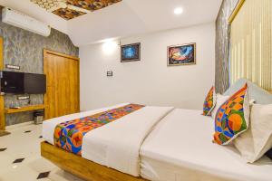Postel nebo postele na pokoji v ubytování FabHotel Signor