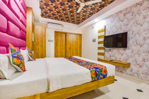 Postel nebo postele na pokoji v ubytování FabHotel Signor